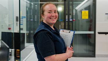 Smiling healthcare worker with clipboard